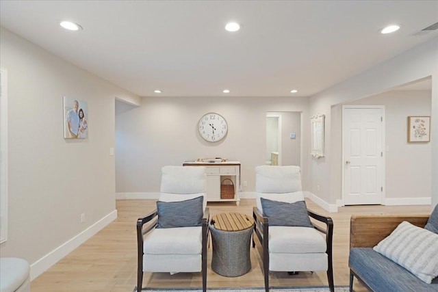 sitting room featuring baseboards, visible vents, recessed lighting, and light wood-type flooring