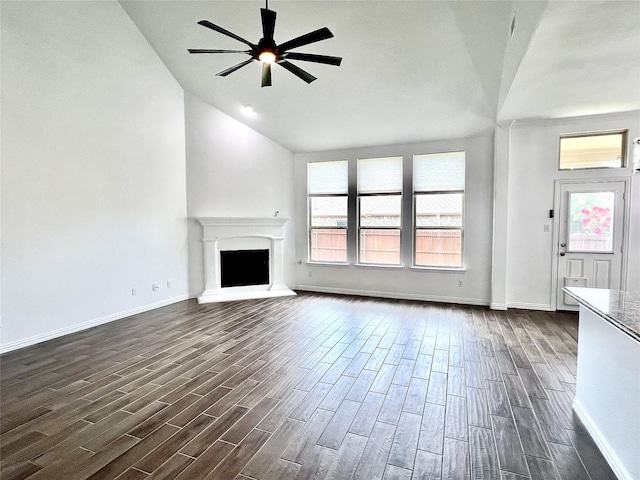 208 Equestrian Ln, Hickory Creek, TX 75065 - unfurnished living room featuring vaulted ceiling, dark wood-style flooring, ceiling fan, and a fireplace with raised hearth
