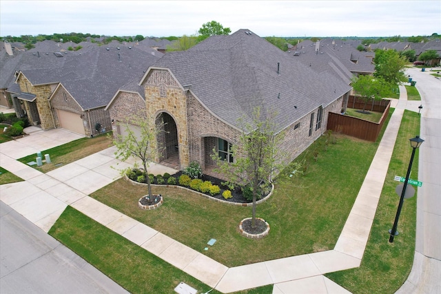 208 Equestrian Ln, Hickory Creek, TX 75065 - view of front of house with stone siding, brick siding, concrete driveway, a garage, and a residential view