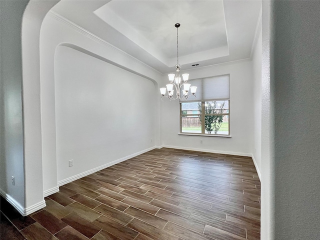208 Equestrian Ln, Hickory Creek, TX 75065 - spare room with a raised ceiling, dark wood finished floors, a chandelier, and ornamental molding