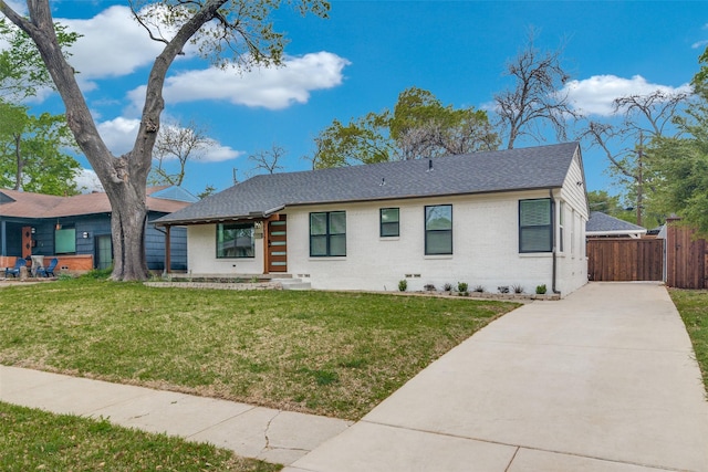 6627 Highgate Ln, Dallas, TX 75214 - view of front facade with concrete driveway, brick siding, and a shingled roof