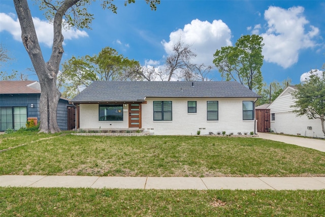 6627 Highgate Ln, Dallas, TX 75214 - view of front of house featuring a front lawn, brick siding, and roof with shingles