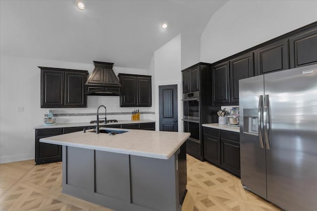 817 Layla Dr, Fate, TX 75087 - kitchen with appliances with stainless steel finishes, custom exhaust hood, decorative backsplash, dark cabinetry, and high vaulted ceiling
