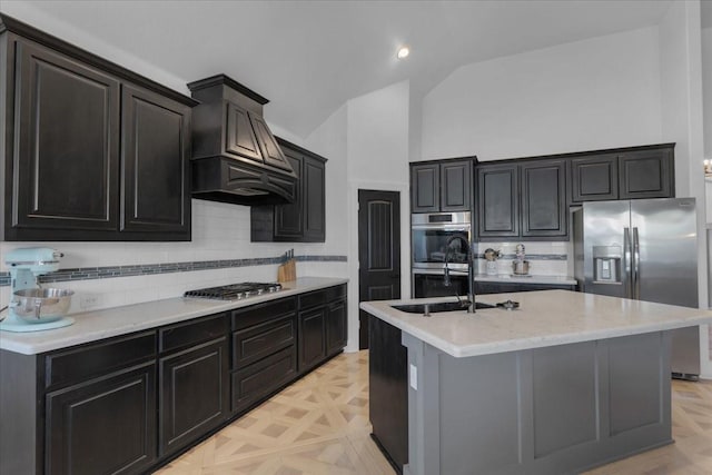 817 Layla Dr, Fate, TX 75087 - kitchen featuring appliances with stainless steel finishes, lofted ceiling, premium range hood, backsplash, and a sink