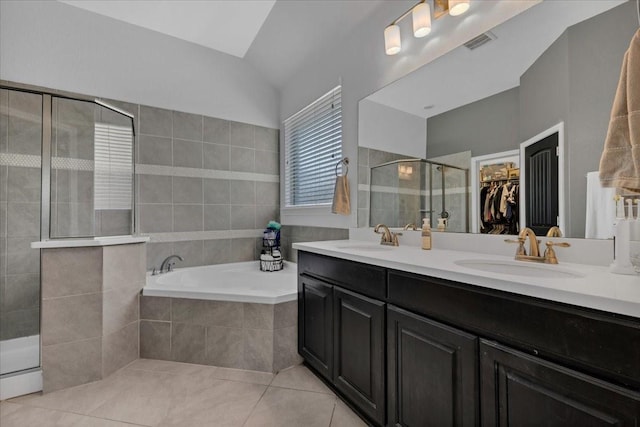 817 Layla Dr, Fate, TX 75087 - full bathroom with a shower stall, double vanity, a bath, a walk in closet, and tile patterned floors