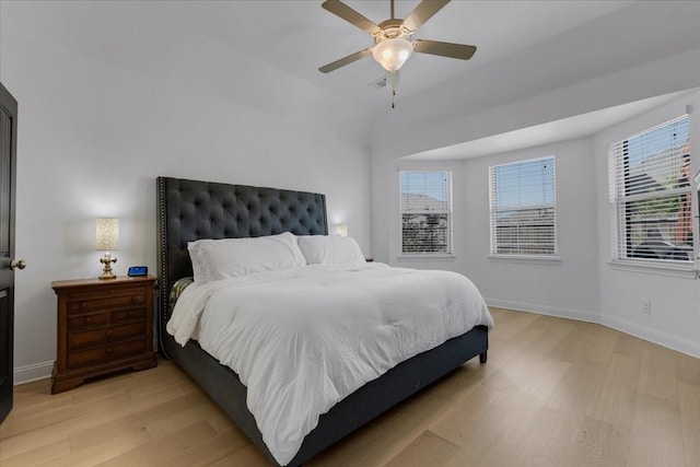 817 Layla Dr, Fate, TX 75087 - bedroom featuring light wood-style floors, multiple windows, and baseboards