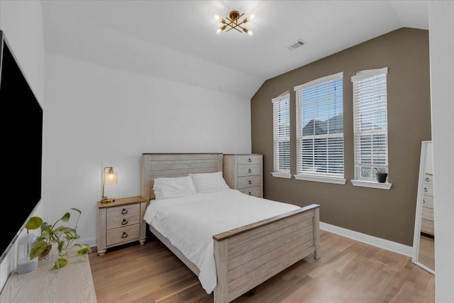 817 Layla Dr, Fate, TX 75087 - bedroom featuring vaulted ceiling, wood finished floors, and baseboards