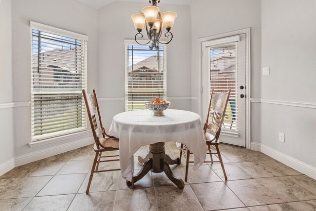 6417 Belhaven Dr, Fort Worth, TX 76123 - dining area featuring a wealth of natural light, a chandelier, baseboards, and light tile patterned floors