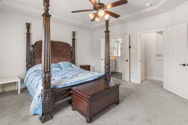 6417 Belhaven Dr, Fort Worth, TX 76123 - carpeted bedroom featuring baseboards, a raised ceiling, ensuite bathroom, and ceiling fan