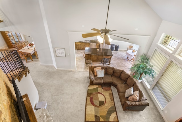 6417 Belhaven Dr, Fort Worth, TX 76123 - carpeted living room with baseboards, a healthy amount of sunlight, ceiling fan, and high vaulted ceiling