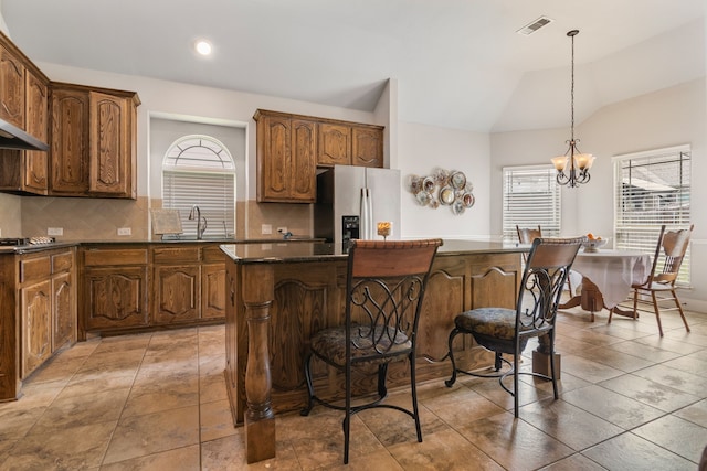 6417 Belhaven Dr, Fort Worth, TX 76123 - kitchen with a wealth of natural light, dark countertops, appliances with stainless steel finishes, and a kitchen island