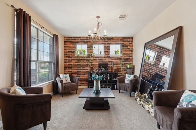 312 Parakeet Dr, Little Elm, TX 75068 - carpeted living room with a chandelier, brick wall, and a wood stove