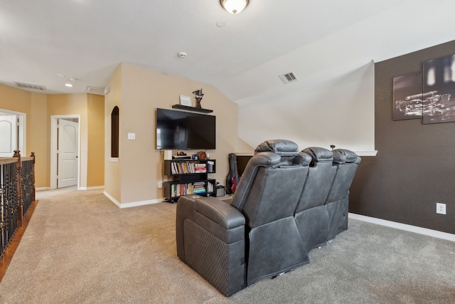living area featuring light colored carpet, visible vents, baseboards, and vaulted ceiling