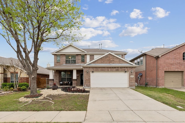 312 Parakeet Dr, Little Elm, TX 75068 - view of front of home with a front yard, driveway, covered porch, an attached garage, and brick siding