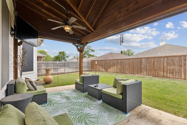 view of patio featuring an outdoor hangout area, a fenced backyard, and a ceiling fan