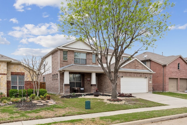 312 Parakeet Dr, Little Elm, TX 75068 - view of front facade with brick siding, driveway, covered porch, and an attached garage
