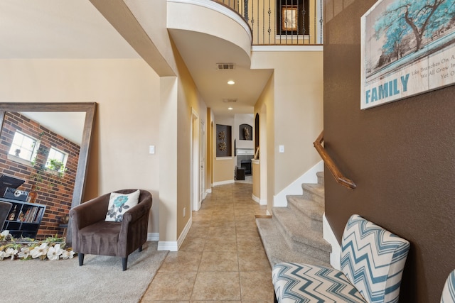 312 Parakeet Dr, Little Elm, TX 75068 - entrance foyer with light tile patterned floors, stairs, and baseboards