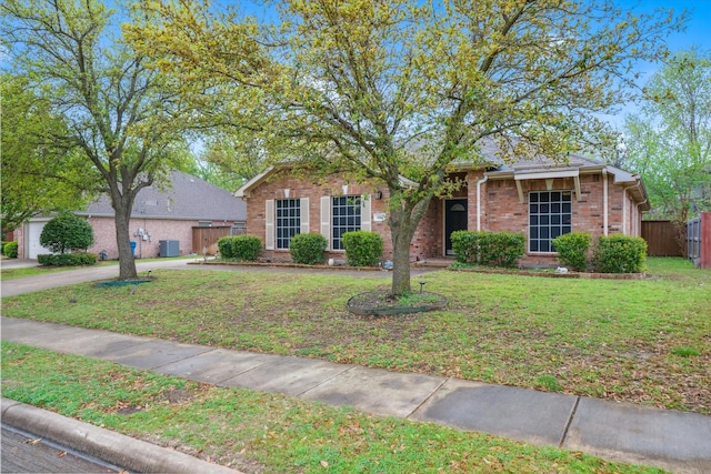 461 Sausalito Dr, Rockwall, TX 75087 - ranch-style home with fence, a front lawn, and brick siding