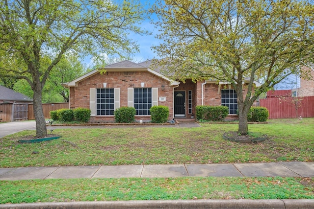 461 Sausalito Dr, Rockwall, TX 75087 - ranch-style home with brick siding, a front yard, and fence