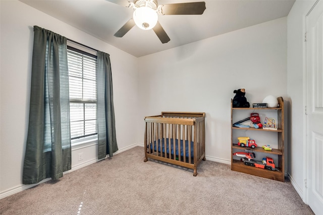 207 Shady Oaks Dr, Runaway Bay, TX 76426 - bedroom featuring carpet flooring, ceiling fan, baseboards, and a nursery area