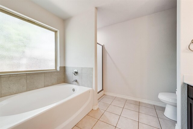207 Shady Oaks Dr, Runaway Bay, TX 76426 - bathroom featuring toilet, a shower stall, vanity, tile patterned flooring, and a garden tub