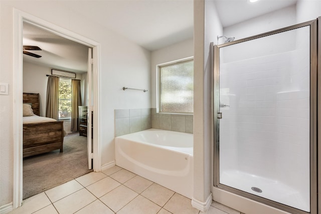 207 Shady Oaks Dr, Runaway Bay, TX 76426 - bathroom with tile patterned flooring, a shower stall, ensuite bath, and a garden tub