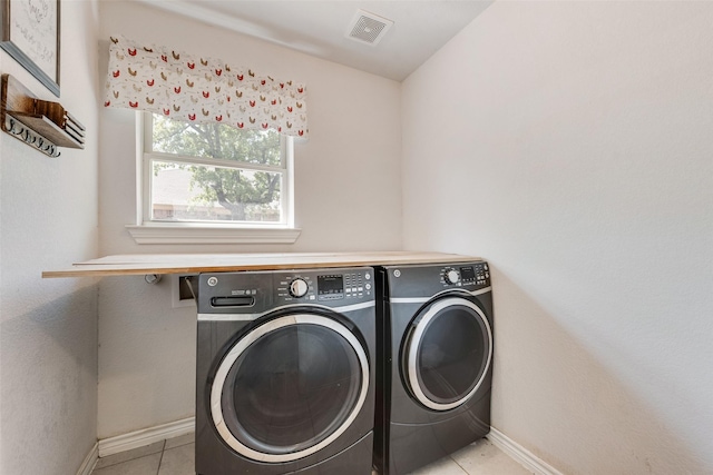 207 Shady Oaks Dr, Runaway Bay, TX 76426 - laundry area featuring baseboards, light tile patterned flooring, visible vents, washer and clothes dryer, and laundry area