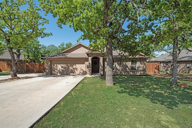 207 Shady Oaks Dr, Runaway Bay, TX 76426 - ranch-style house featuring a garage, fence, brick siding, a front lawn, and driveway