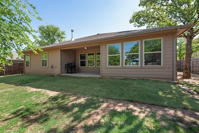 207 Shady Oaks Dr, Runaway Bay, TX 76426 - back of house featuring a yard, fence, and a patio
