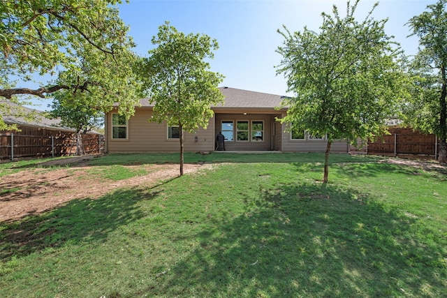 207 Shady Oaks Dr, Runaway Bay, TX 76426 - back of house with a yard and a fenced backyard