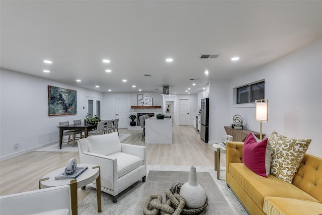10606 Estate Ln, Dallas, TX 75238 - living area with recessed lighting, light wood finished floors, and baseboards