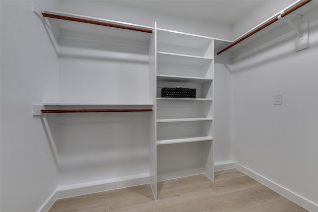 10606 Estate Ln, Dallas, TX 75238 - spacious closet with wood finished floors