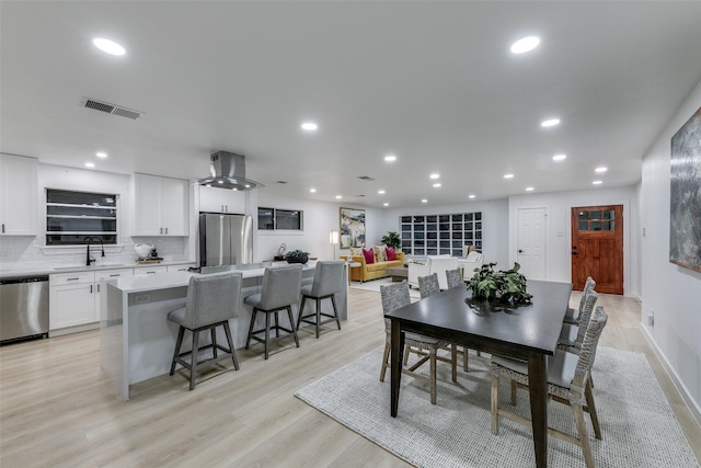 10606 Estate Ln, Dallas, TX 75238 - dining space with light wood finished floors, recessed lighting, and baseboards