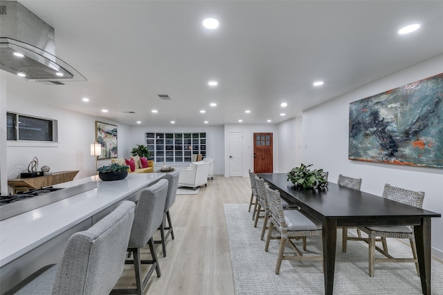 10606 Estate Ln, Dallas, TX 75238 - dining space featuring light wood-style flooring and recessed lighting