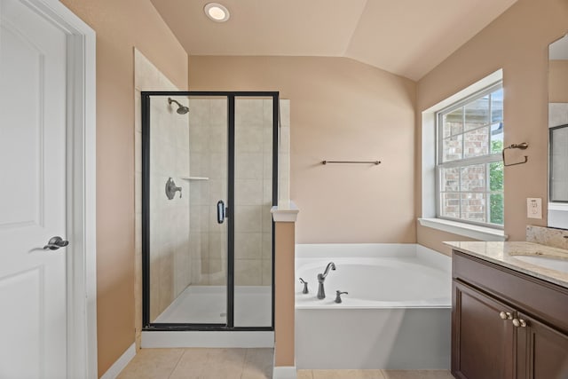 bathroom with tile patterned flooring, vanity, a shower stall, lofted ceiling, and a bath
