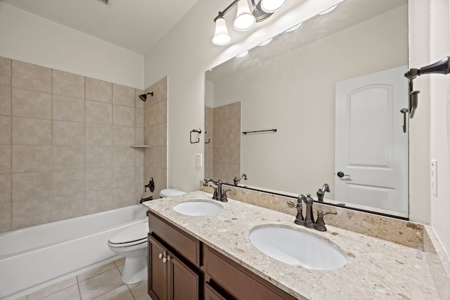 bathroom featuring a sink, tile patterned floors, shower / bathtub combination, and toilet