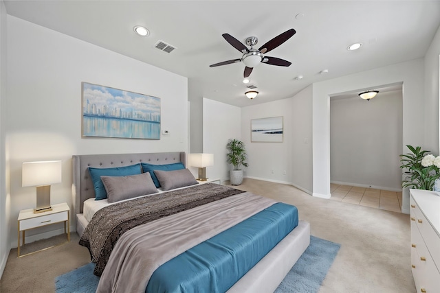 bedroom featuring visible vents, baseboards, recessed lighting, light colored carpet, and a ceiling fan