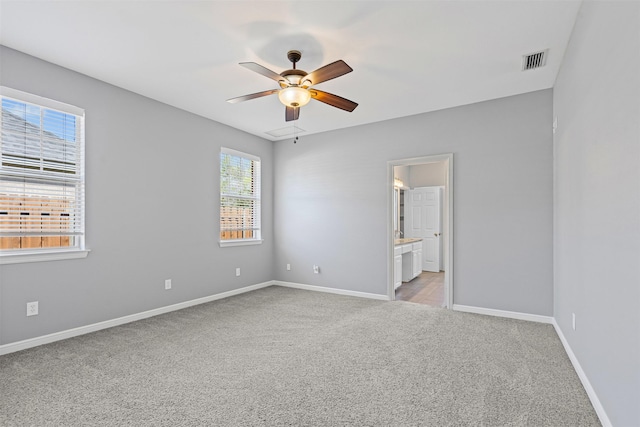729 Ridgeway Blvd, Weatherford, TX 76086 - unfurnished room featuring light carpet, ceiling fan, and baseboards