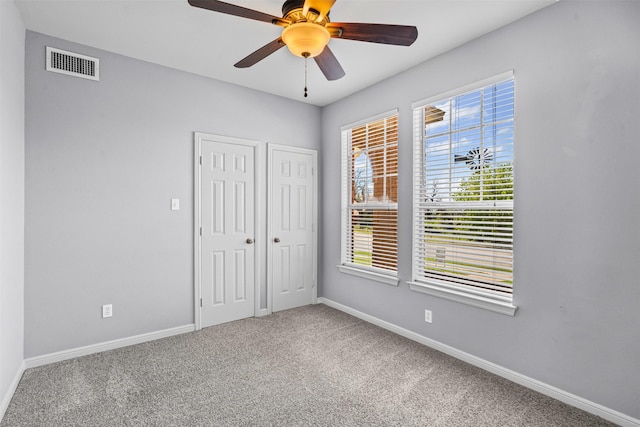 729 Ridgeway Blvd, Weatherford, TX 76086 - unfurnished bedroom featuring carpet floors, baseboards, and multiple windows