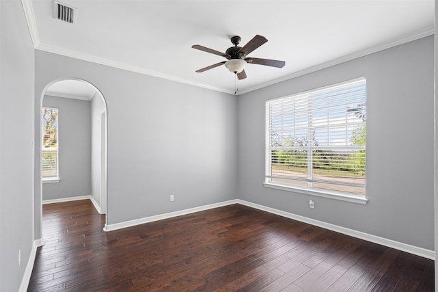 729 Ridgeway Blvd, Weatherford, TX 76086 - spare room featuring arched walkways, dark wood-type flooring, baseboards, a ceiling fan, and crown molding