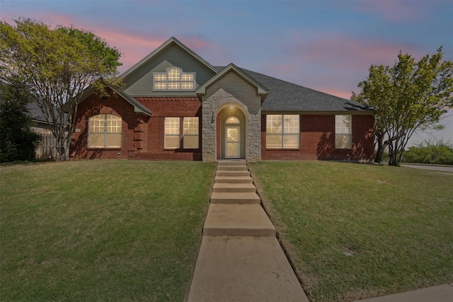 729 Ridgeway Blvd, Weatherford, TX 76086 - traditional home featuring a lawn and brick siding