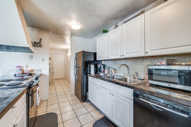 5212 Knox Dr, The Colony, TX 75056 - kitchen featuring light tile patterned floors, a sink, black appliances, and white cabinetry
