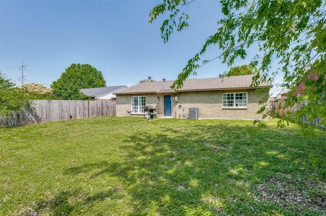 5212 Knox Dr, The Colony, TX 75056 - back of house featuring a yard, a fenced backyard, brick siding, and central air condition unit