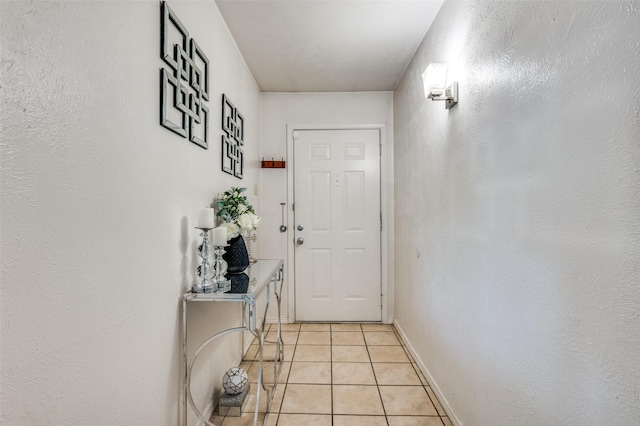 5212 Knox Dr, The Colony, TX 75056 - doorway featuring light tile patterned floors and baseboards