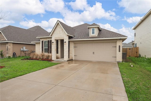11220 Pallasite Ct, Waco, TX 76655 - view of front of property featuring a shingled roof, an attached garage, stone siding, concrete driveway, and brick siding