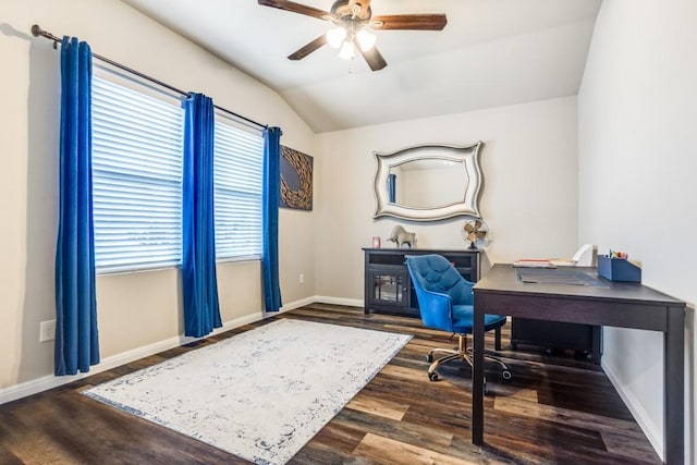 office area featuring ceiling fan, vaulted ceiling, wood finished floors, and baseboards