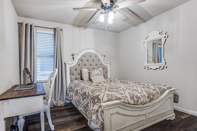 bedroom with dark wood-style flooring, baseboards, a ceiling fan, and multiple windows