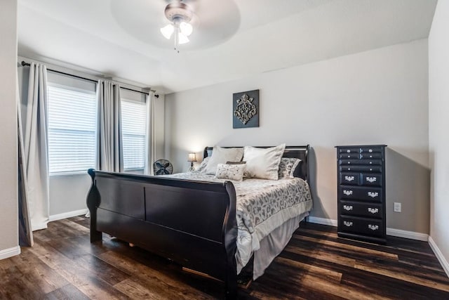 bedroom featuring dark wood-style floors, baseboards, and ceiling fan