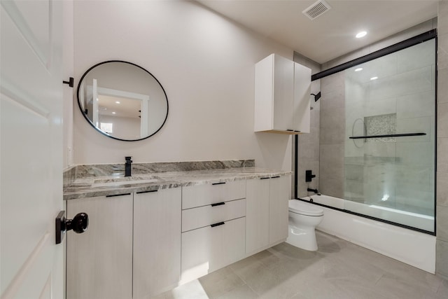 1623 Lansford Ave, Dallas, TX 75224 - full bathroom featuring toilet, vanity, combined bath / shower with glass door, and visible vents