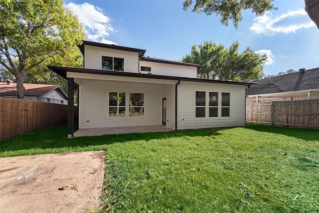 1623 Lansford Ave, Dallas, TX 75224 - rear view of property with a fenced backyard, a yard, and a patio area